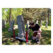 Installer kneeling beside a monument with Tombstone Jack lift feet in place