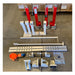 Tombstone Jack lifting equipment components laid out on a warehouse floor