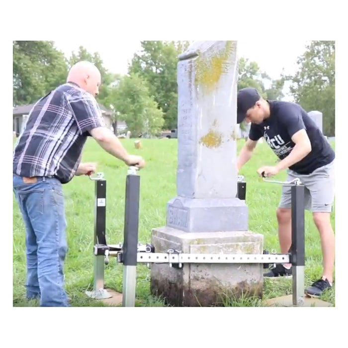 Two installers raising a monument with Tombstone Jack lifting posts