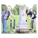 Two installers raising a monument with Tombstone Jack lifting posts